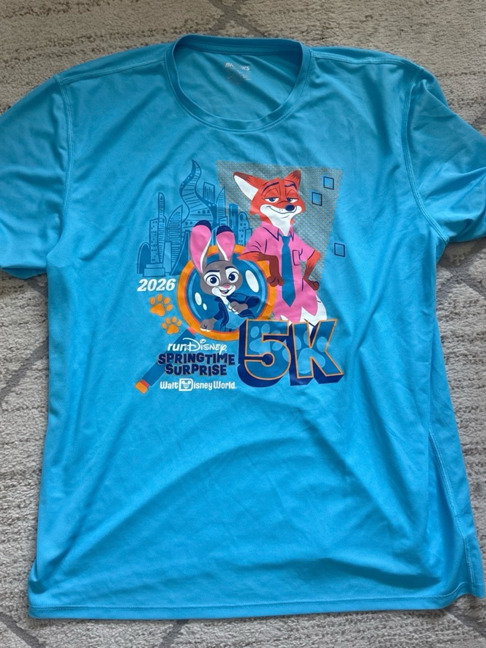 Brooks men’s Bright Turquoise Zootopia 5K Graphic Tee